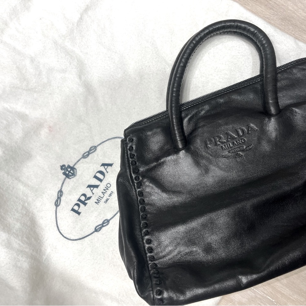 Black real leather mini handbag. Kept in dust bag.